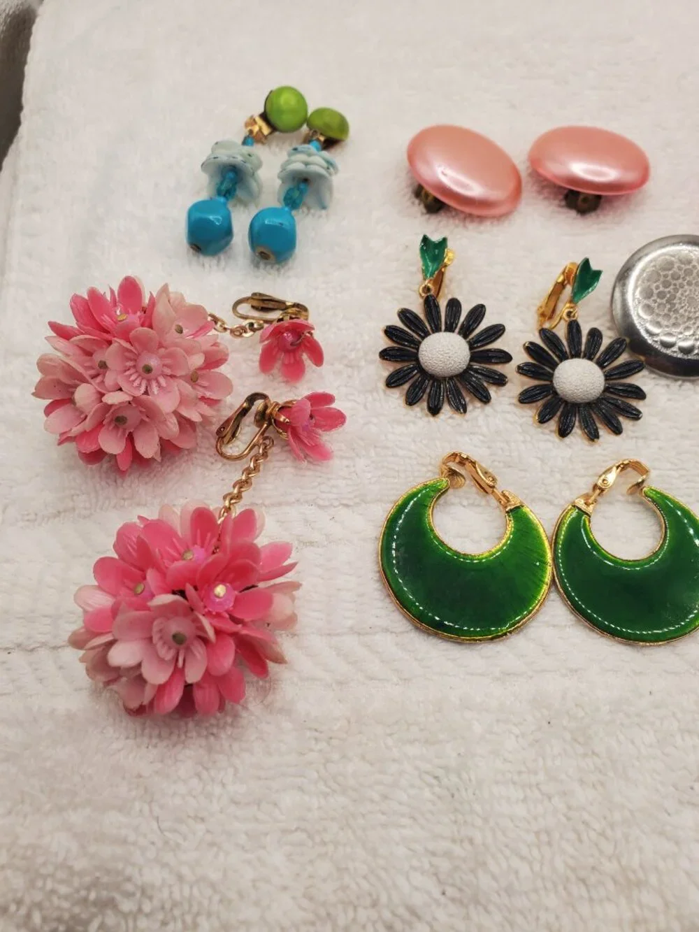 12 Pair of clip on earrings, items # B-2106-2117,.  wt. 123 grams.